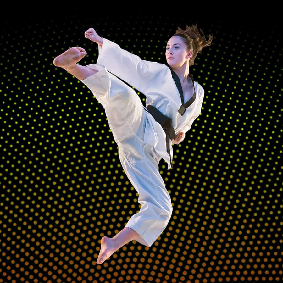 Martial Arts Lessons for Adults in North Plainfield NJ - Girl Black Belt Jumping High Kick